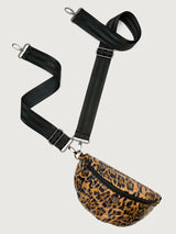 Leopard print crossbody bag with a black strap on a light gray background