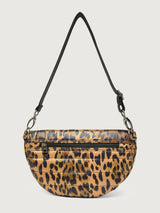 Leopard print crossbody bag with a black strap on a light gray background