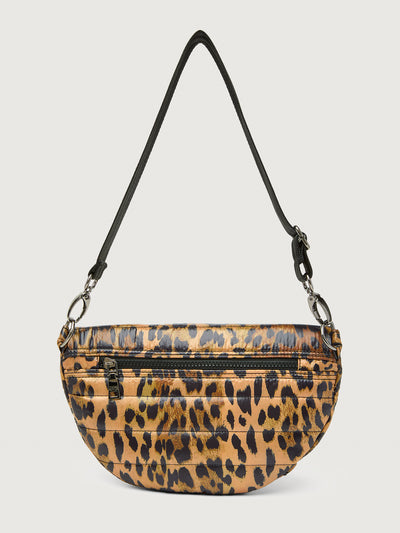 Leopard print crossbody bag with a black strap on a light gray background