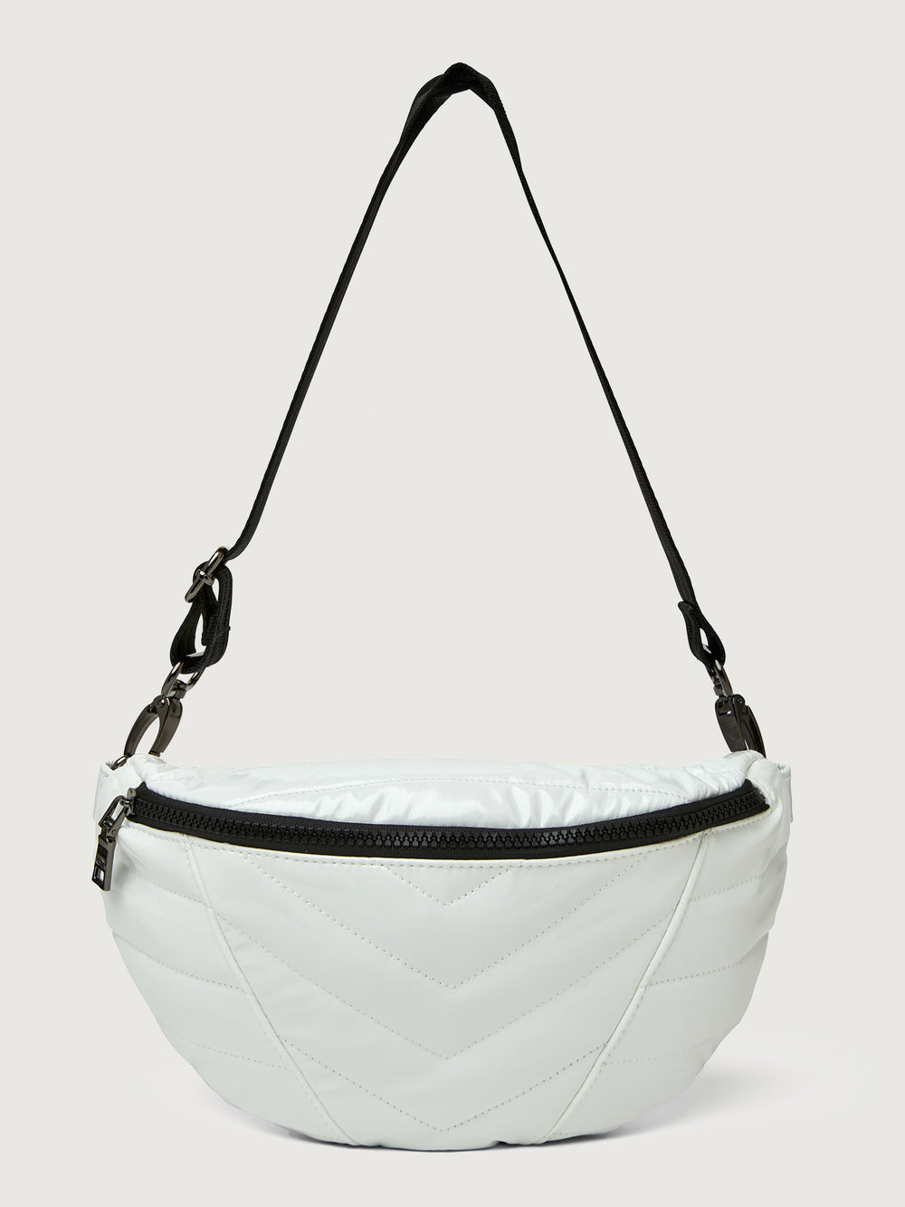 White patent leather bag with black hardware, featuring a half moon shape.