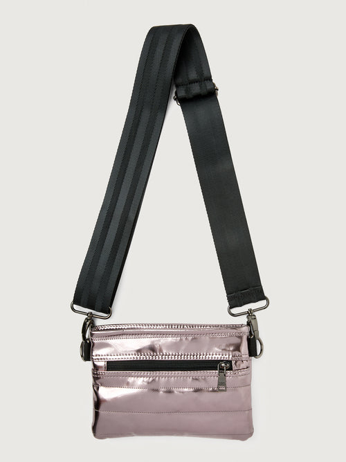 Misty metallic mirror bag with a black crossbody strap and a silver buckle.