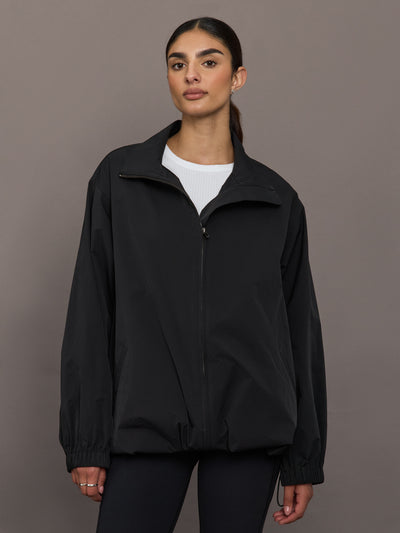 Model is wearing the Corben Jacket in black, front view.