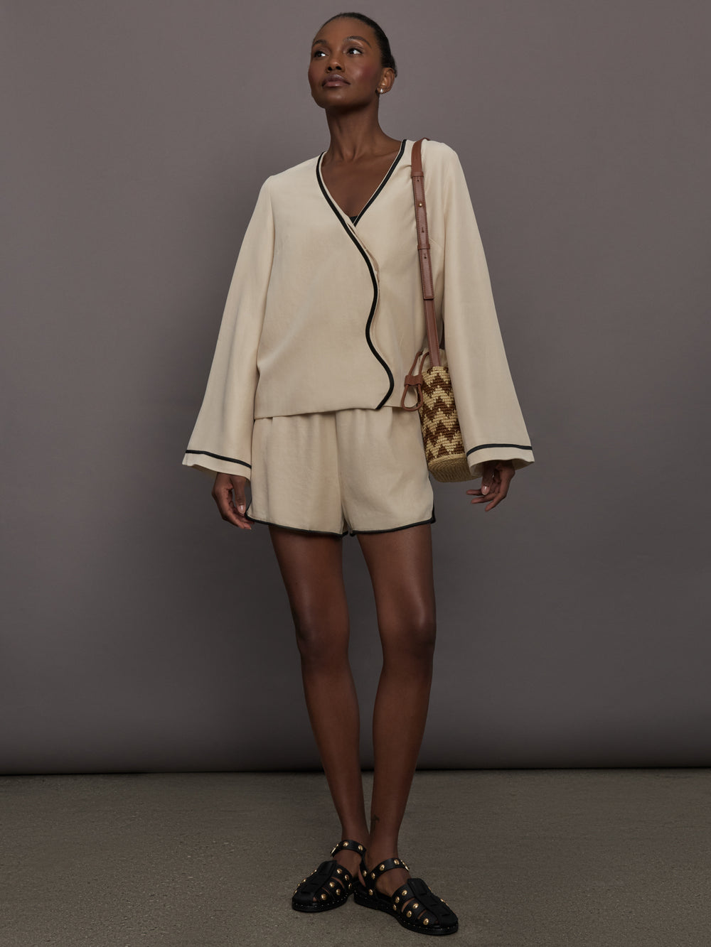 Model is wearing the Yumi Short in Fawn with matching top, full body front view.