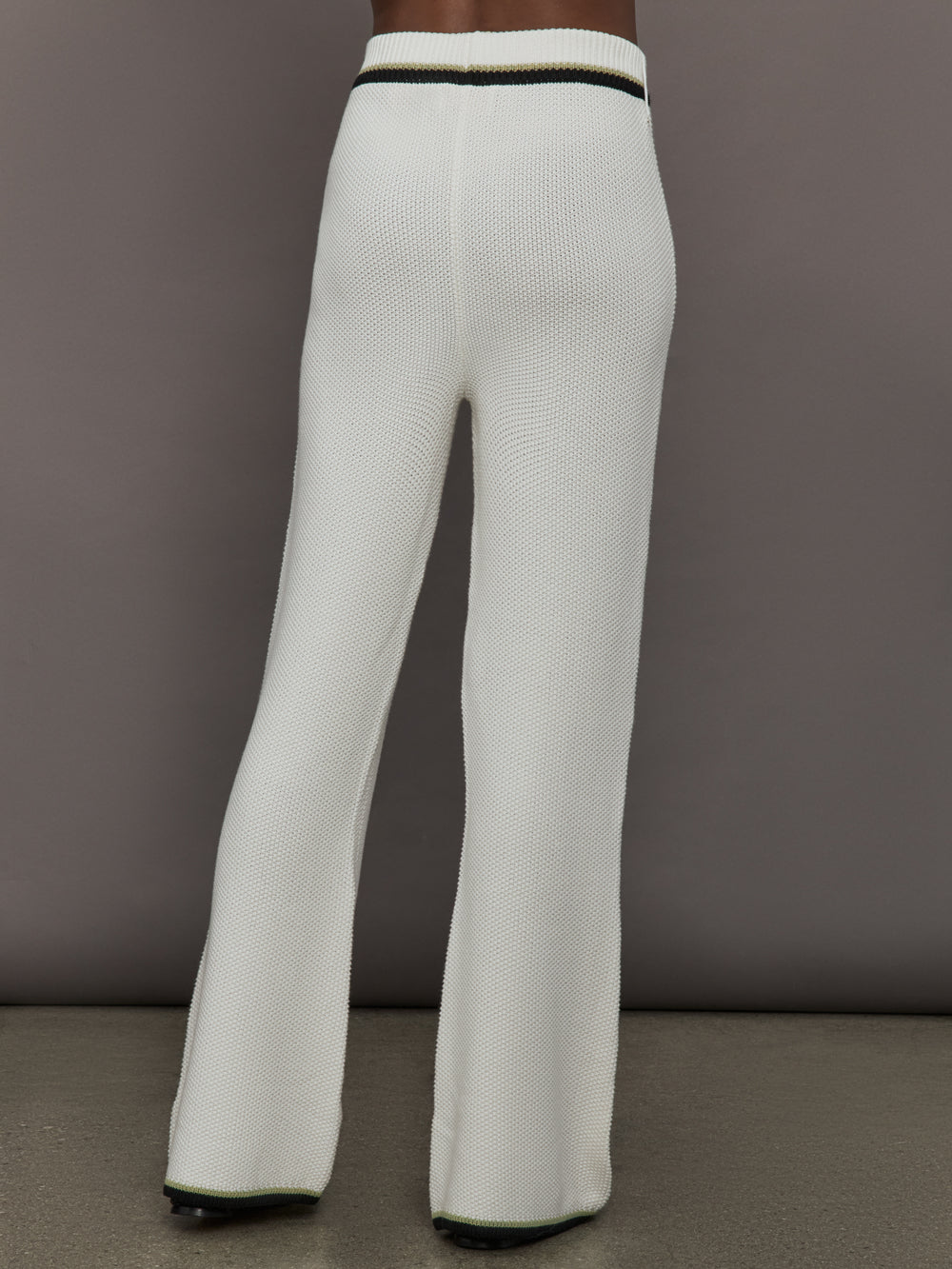 Model is wearing the Soraya Knit Full-Length Pant Sea Salt, back view.