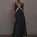 Model is wearing the Onyx embroidered cupro maxi dress, front view.
