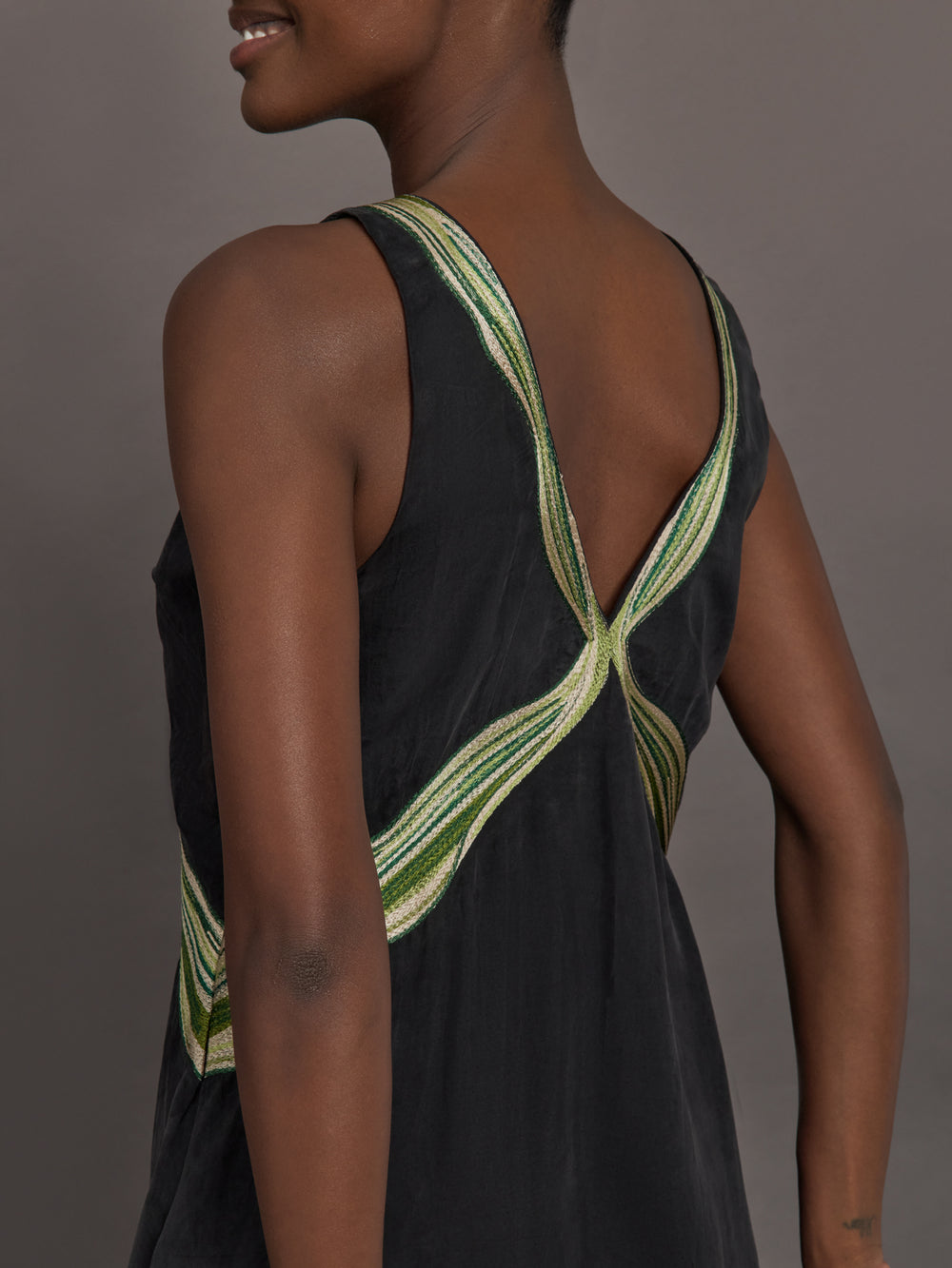 Close up of the Onyx embroidered cupro maxi dress, back neckline detail.