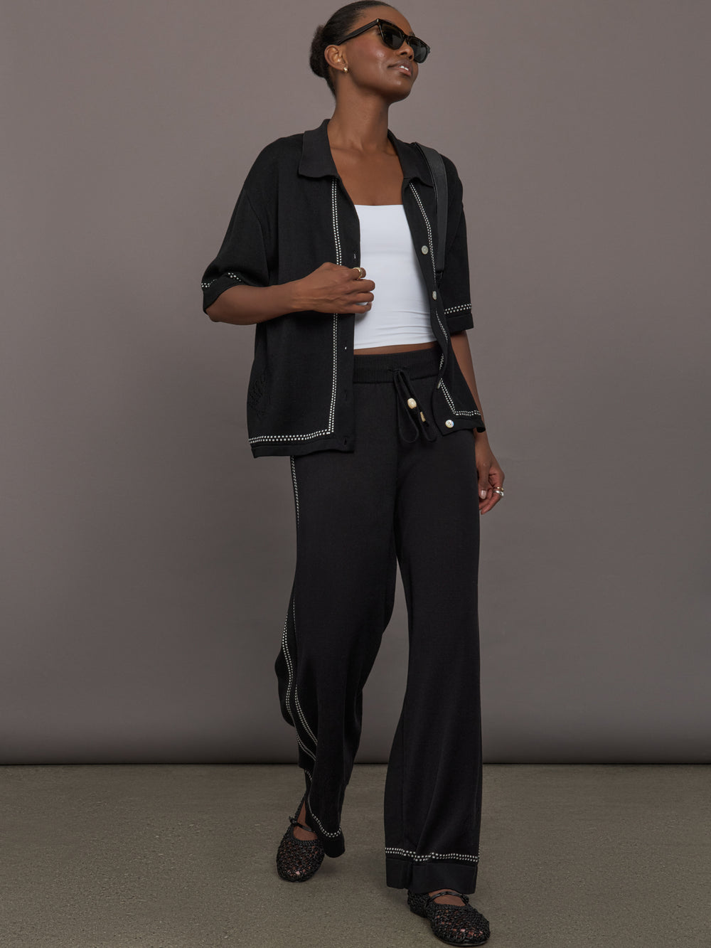 Model is wearing the Lawrence Knit Pant Ink, full body view.