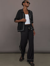 Model is wearing the Lawrence Knit Pant Ink, full body view.