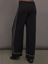 Model is wearing the Lawrence Knit Pant Ink, back view.