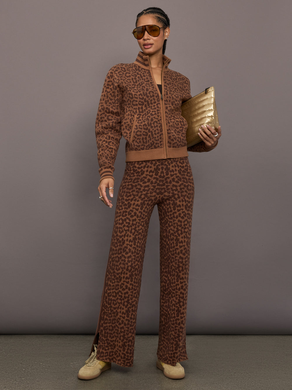 Model is wearing Malawi Knit Straight Leg Pant in Leopard, full body view styled with matching knit top.
