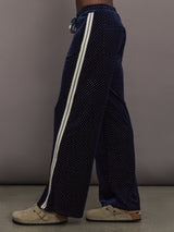 Model is wearing Velour High-Waisted Wide-Leg Pant in Polka Dot, side view.