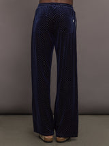 Model is wearing Velour High-Waisted Wide-Leg Pant in Polka Dot, back view.