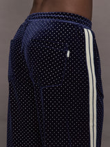 Model is wearing Velour High-Waisted Wide-Leg Pant in Polka Dot, back pocket close-up.