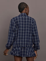 Model is wearing Check Jacquard Zip-Front Bomber Jacket in Navy, back view.