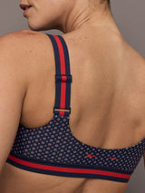 Model wears the Cavallo Scoop Neck Nina Bra in Abstract with a scoop neckline and an artistic print with a supportive, form-fitting design