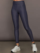 Model wears the Cavallo 28in Pant in Abstract with an artistic print and a slim, tailored fit that's ankle-length.