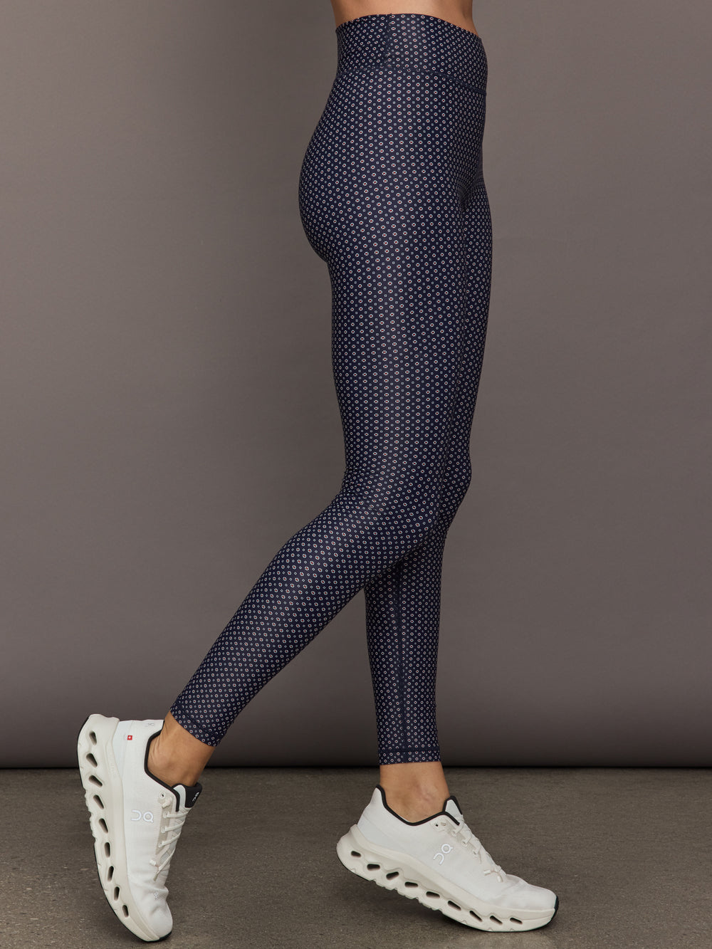 Model wears the Cavallo 28in Pant in Abstract with an artistic print and a slim, tailored fit that's ankle-length.