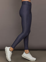 Model wears the Cavallo 28in Pant in Abstract with an artistic print and a slim, tailored fit that's ankle-length.