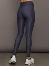 Model wears the Cavallo 28in Pant in Abstract with an artistic print and a slim, tailored fit that's ankle-length.