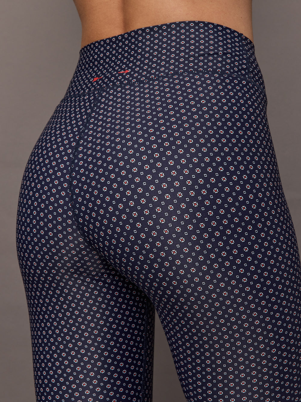 Model wears the Cavallo 28in Pant in Abstract with an artistic print and a slim, tailored fit that's ankle-length.