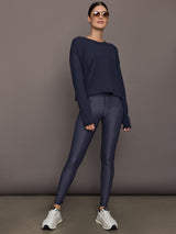 Model wears the Cavallo 28in Pant in Abstract with an artistic print and a slim, tailored fit that's ankle-length.