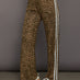 Model wears relaxed-fit pants with animal print, two white stripes down the side and an elastic waistband.