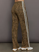 Model wears relaxed-fit pants with animal print, two white stripes down the side and an elastic waistband.