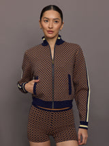 Model wearing a geometric patterned track jacket.