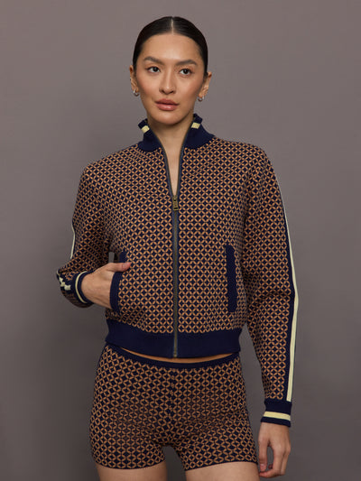 Model wearing a geometric patterned track jacket.