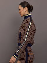 Model wearing a geometric patterned track jacket.
