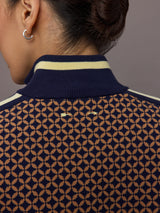 Model wearing a geometric patterned track jacket.