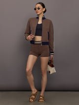 Model wearing a geometric patterned track jacket.