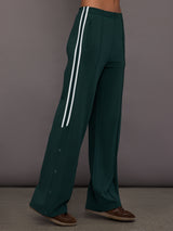 Green wide-leg track pants with white stripes 