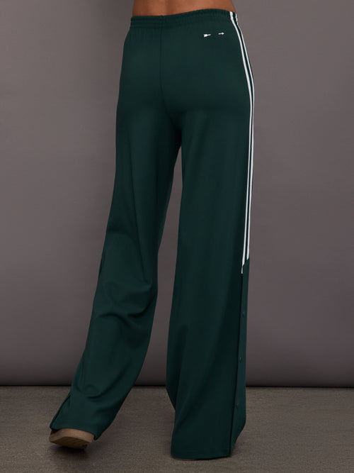 Green wide-leg track pants with white stripes 