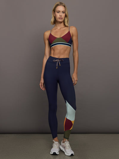 Model wearing a colorful sports bra