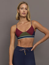 Model wearing a colorful sports bra