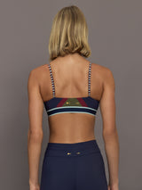 Model wearing a colorful sports bra