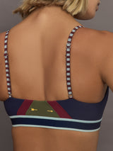Model wearing a colorful sports bra