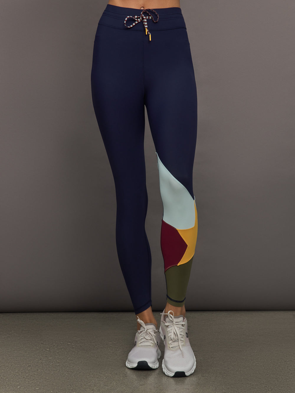 Model wearing Navy leggings with colorful abstract design.
