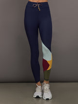 Model wearing Navy leggings with colorful abstract design.