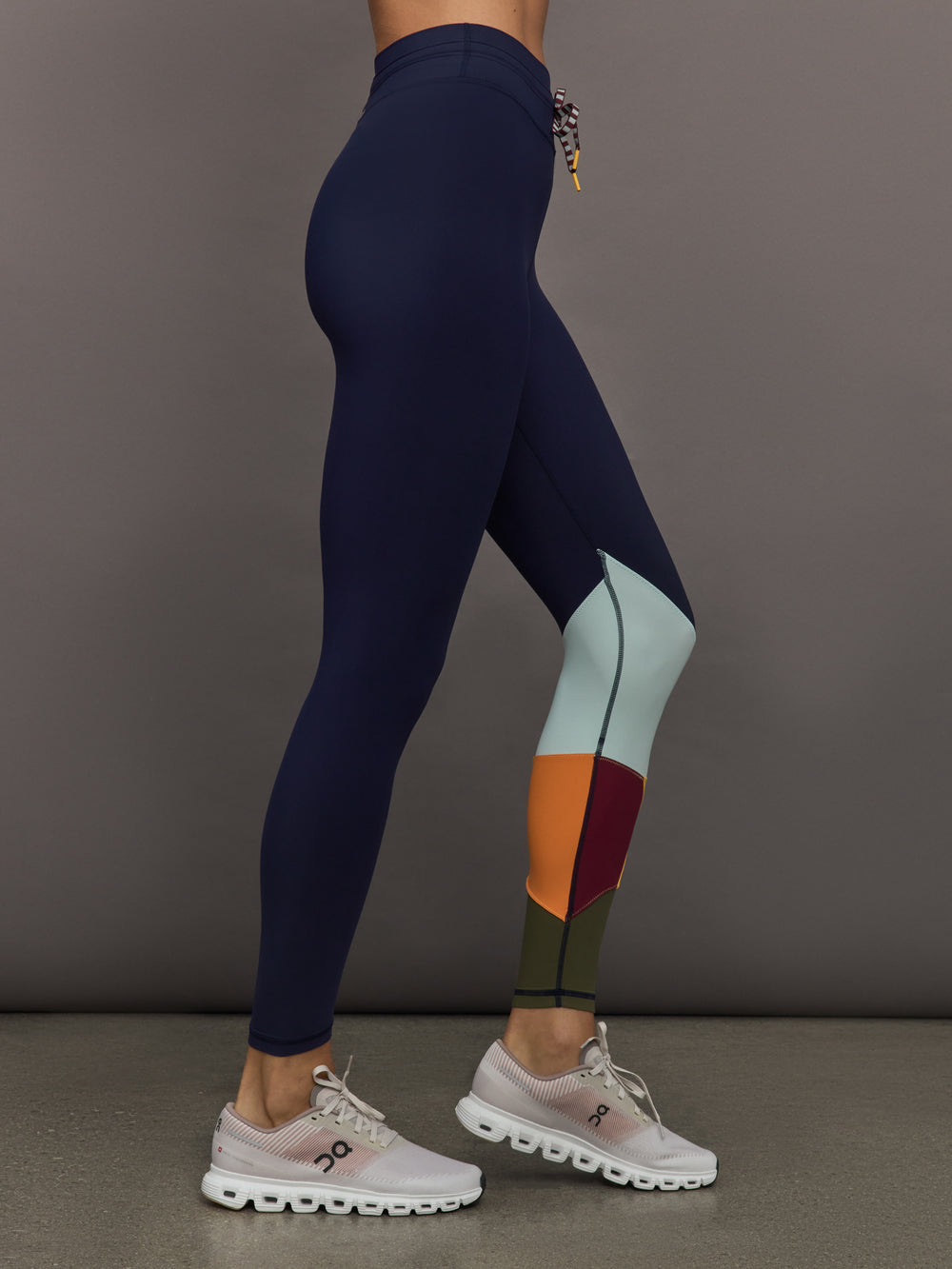 Model wearing Navy leggings with colorful abstract design.