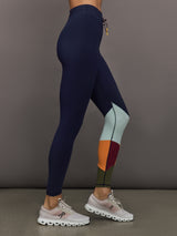 Model wearing Navy leggings with colorful abstract design.