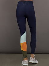Model wearing Navy leggings with colorful abstract design.