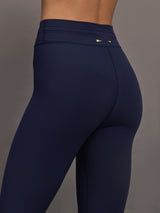 Model wearing Navy leggings with colorful abstract design.