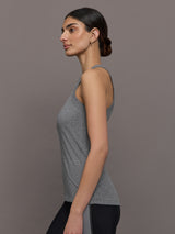 Model wears a heather gray high neck tank top. 