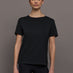 Model wears an oversized classic black tee shirt. 