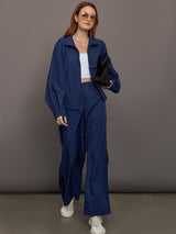 Model wears the Ulite nylon jacket in dark blue with a front zipper closure and relaxed fit.