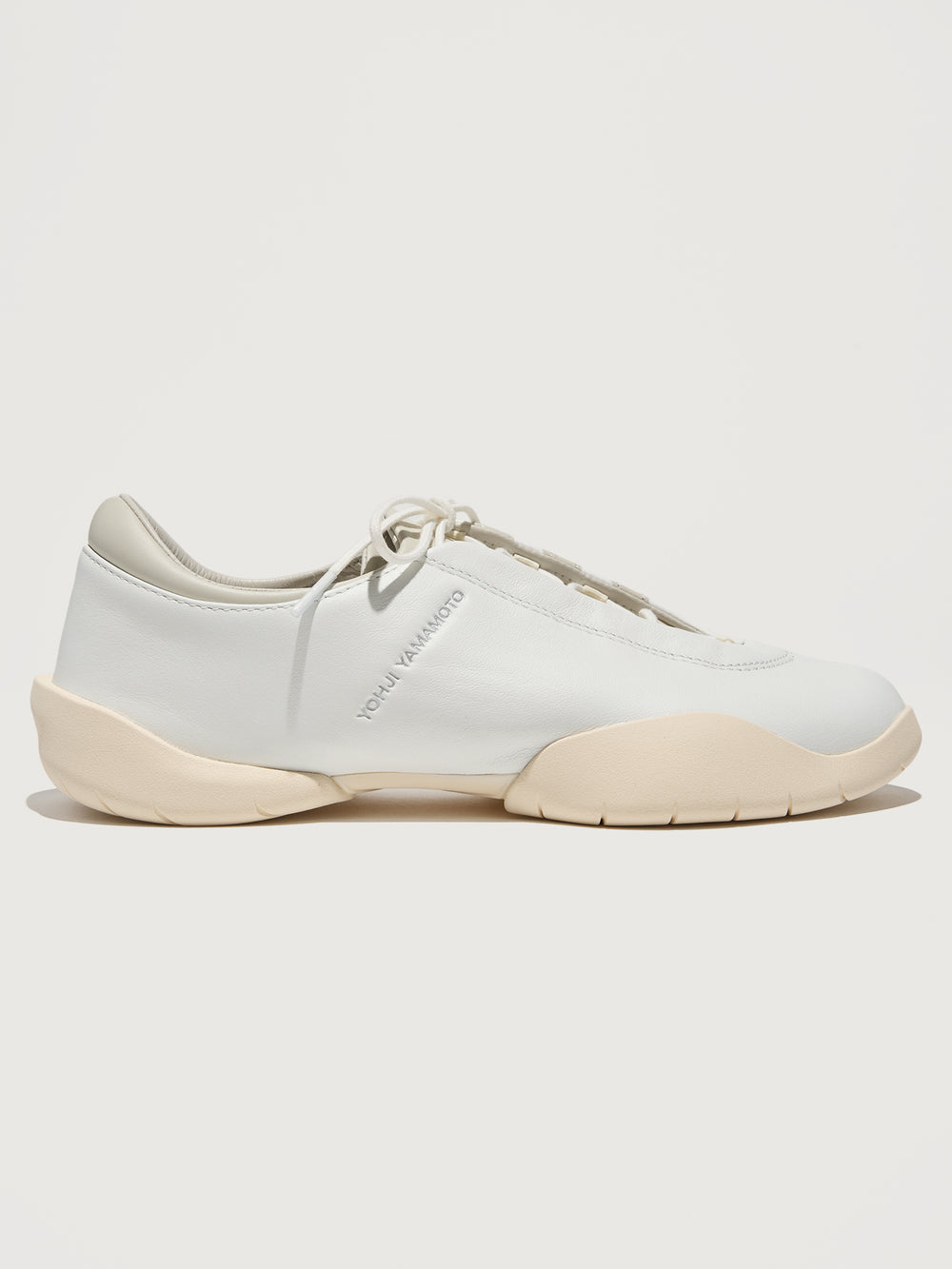 Y-3 Regu Leather sneakers in Cwhite, Talc, and Wonwhi, with a low top and lace-up closure.