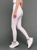 Model wears Gingham Leggings on a grey background