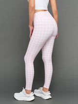 Model wears Gingham Leggings on a grey background